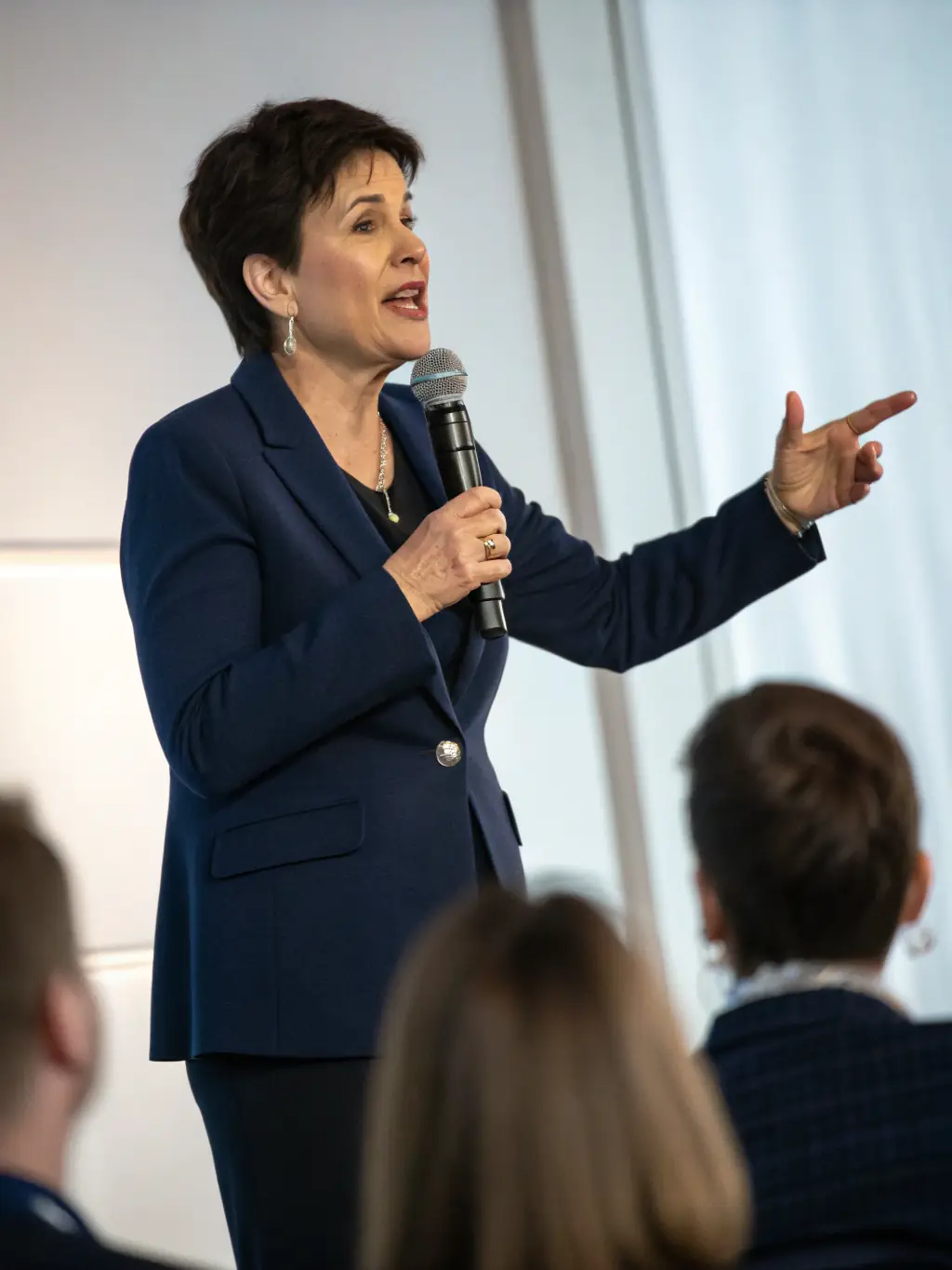 A picture of a speaker presenting at a public lecture on the Resistance, with an engaged audience listening attentively.